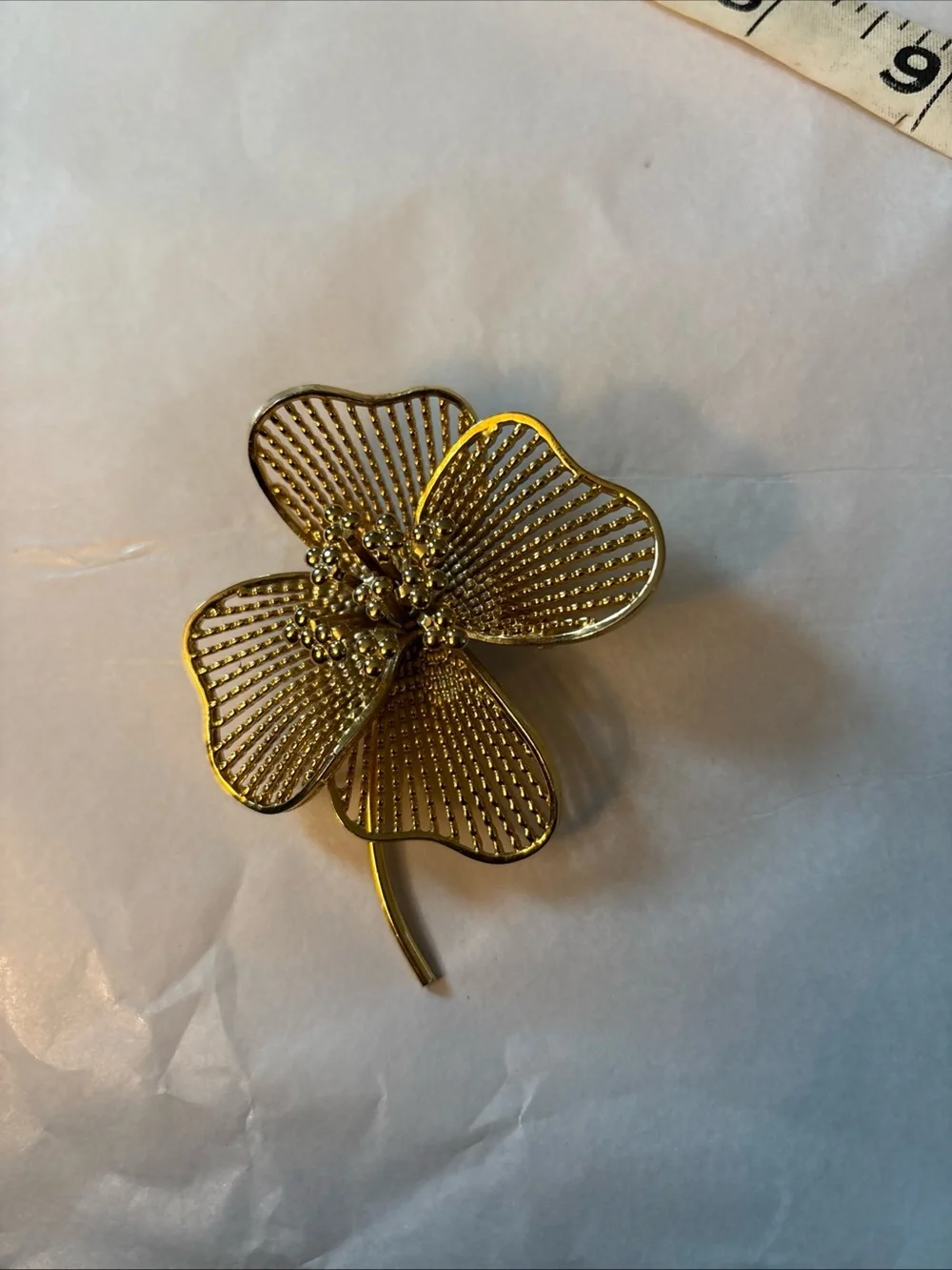 Gold Tone  4 Leaf Clover or flower brooch. Approximately 3 inches.